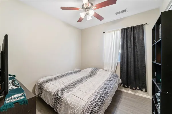 a bedroom with bed and window