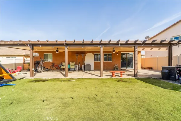 a view of a house with swimming pool and sitting area
