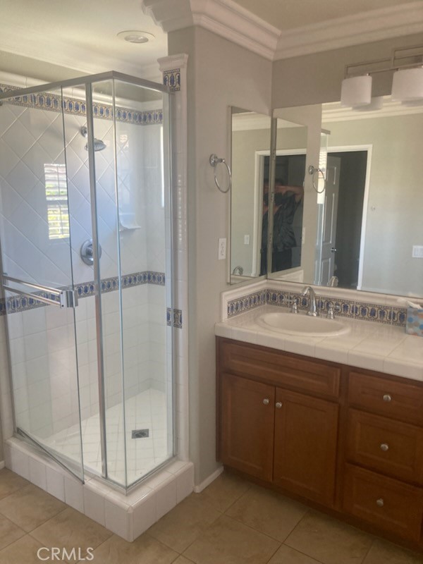 61 Autumn Irvine, CA 92602 - Photo 11 of 14 a bathroom with a shower sink and mirror