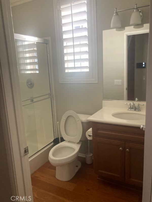 61 Autumn Irvine, CA 92602 - Photo 13 of 14 a bathroom with a sink a toilet a window and shower