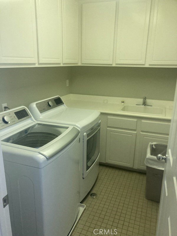 61 Autumn Irvine, CA 92602 - Photo 4 of 14 a utility room with sink dryer and washer