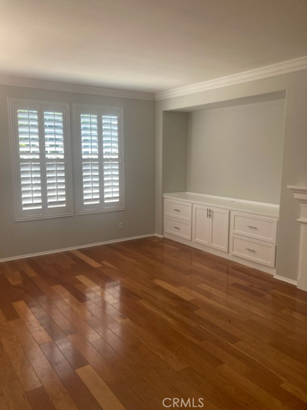 61 Autumn Irvine, CA 92602 - Photo 8 of 14 a view of an empty room with wooden floor and a window