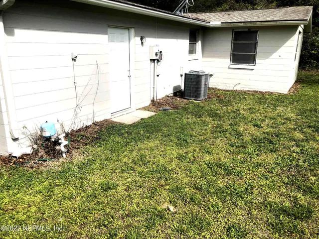 a house view with a backyard space