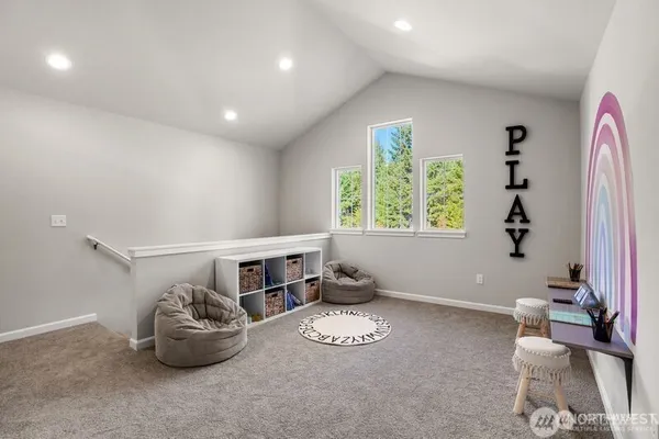 a spacious bedroom with a bed and a window