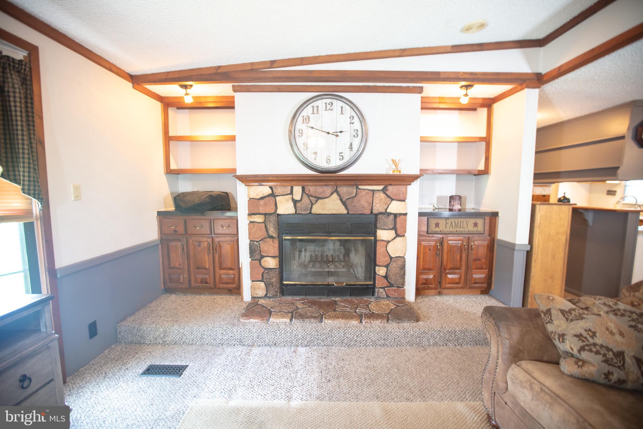 2555 Fords Corner Road Hartly, DE 19953 - Photo 15 of 43 a living room with furniture a clock and a large window