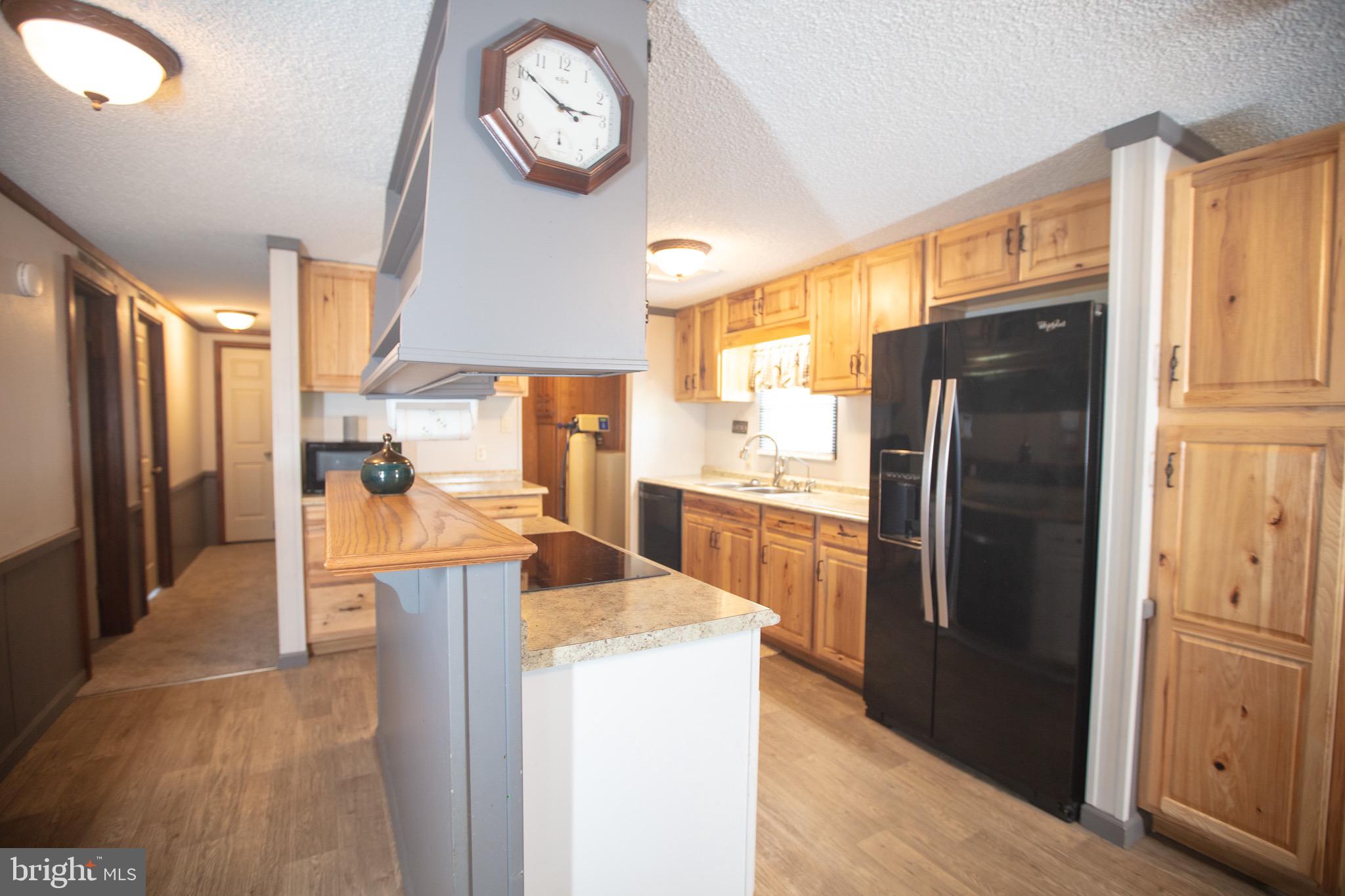 2555 Fords Corner Road Hartly, DE 19953 - Photo 20 of 43 a kitchen with stainless steel appliances granite countertop a refrigerator a oven a sink and a refrigerator