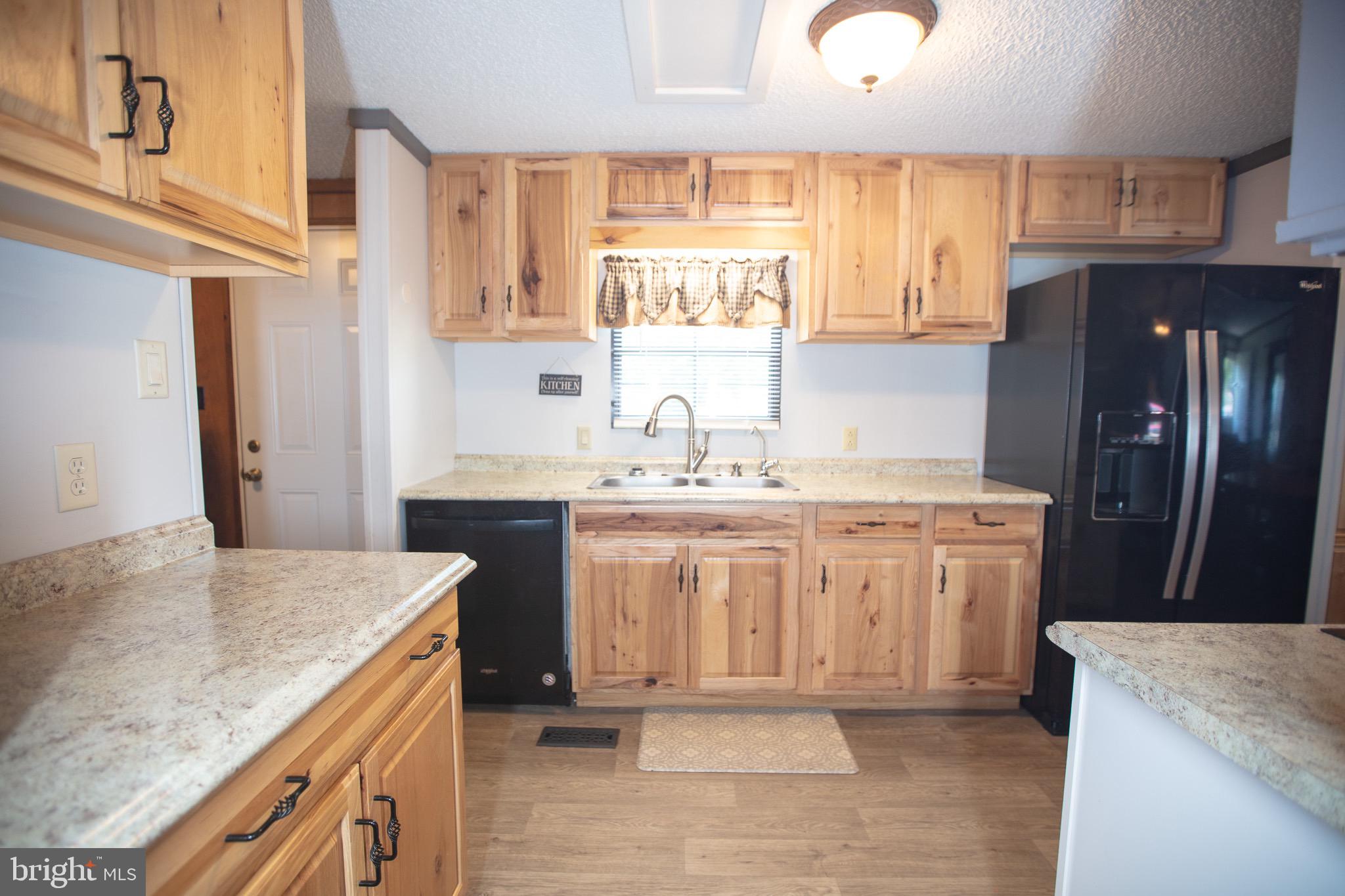 2555 Fords Corner Road Hartly, DE 19953 - Photo 21 of 43 a kitchen with granite countertop a sink a stove a refrigerator and island