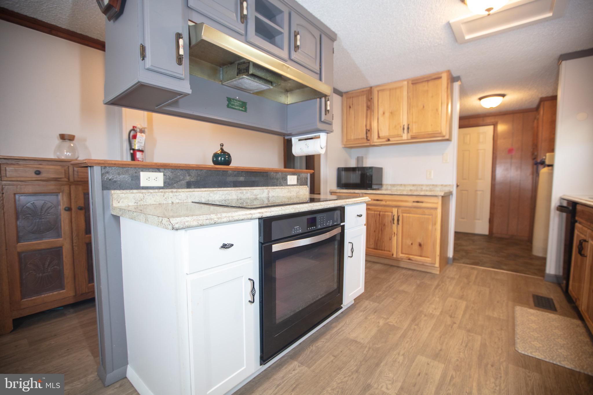 2555 Fords Corner Road Hartly, DE 19953 - Photo 23 of 43 a kitchen with a stove top oven and refrigerator
