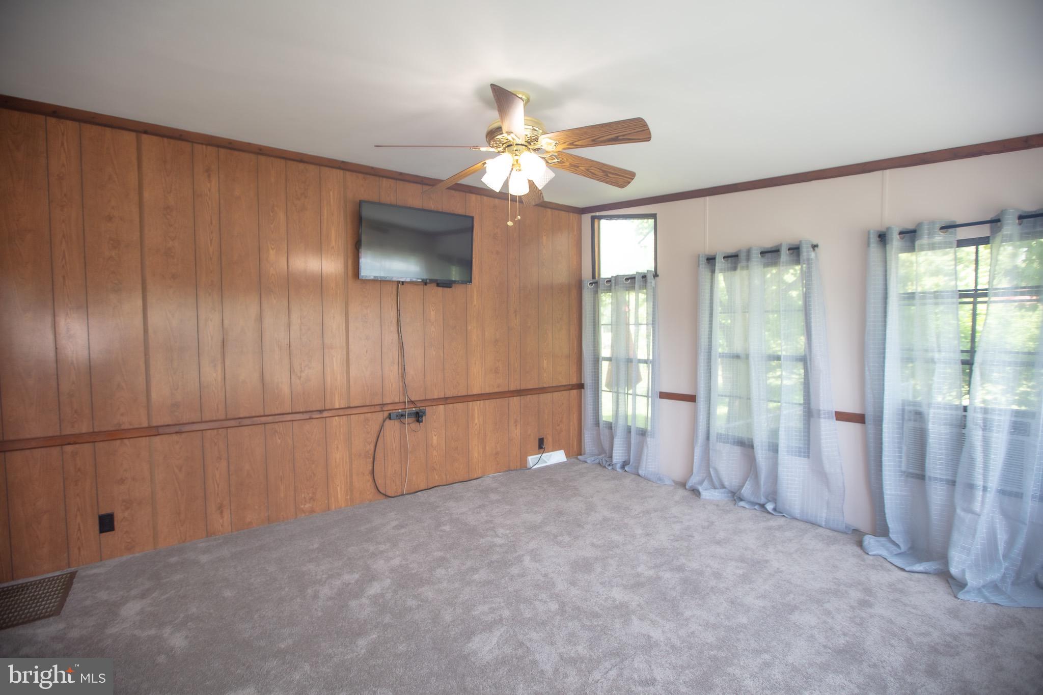 2555 Fords Corner Road Hartly, DE 19953 - Photo 42 of 43 a view of a livingroom with a ceiling fan and window