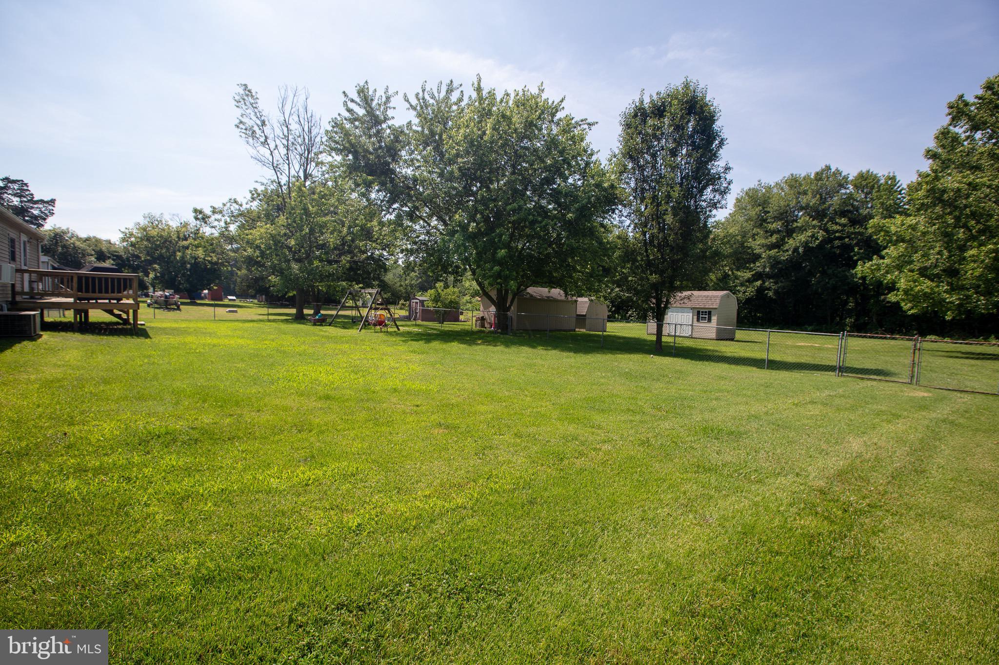 2555 Fords Corner Road Hartly, DE 19953 - Photo 9 of 43 a view of a green field with wooden fence