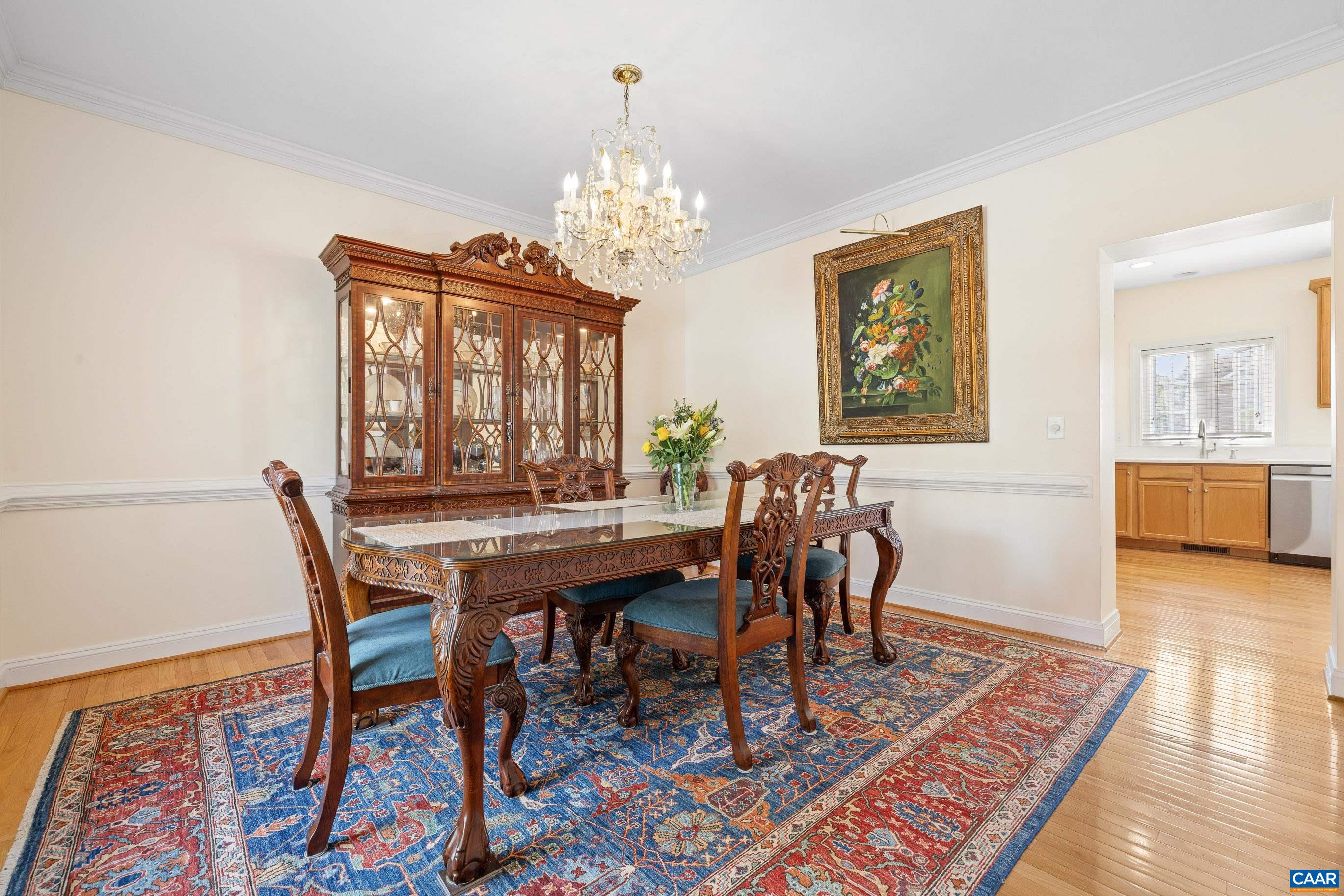 1236 Amber Ridge Road Charlottesville, VA 22901 - Photo 8 of 56 a view of a dining room with furniture a rug and wooden floor