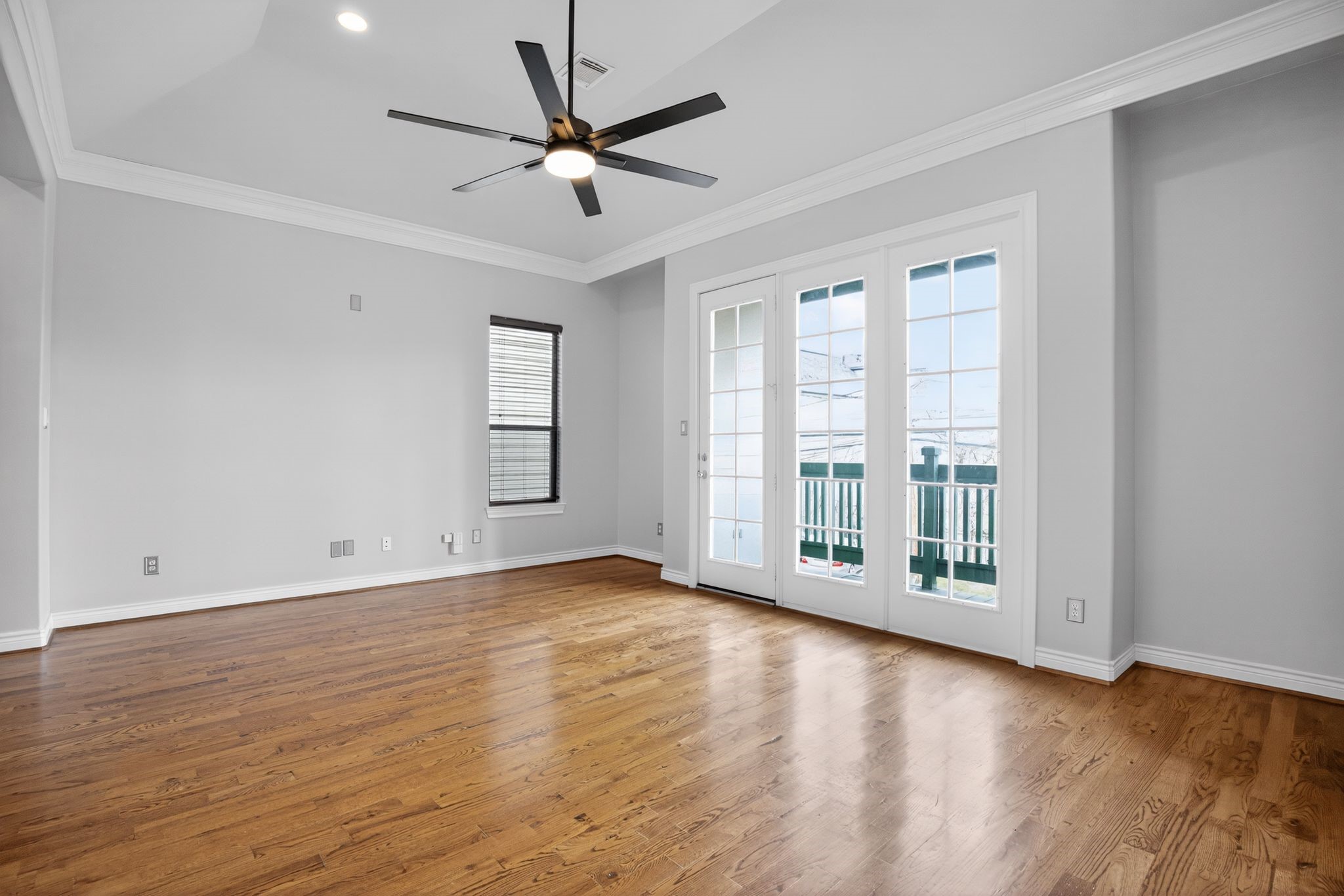 5719 Darling Street Houston, TX 77007 - Photo 18 of 35 a view of an empty room with wooden floor and a window