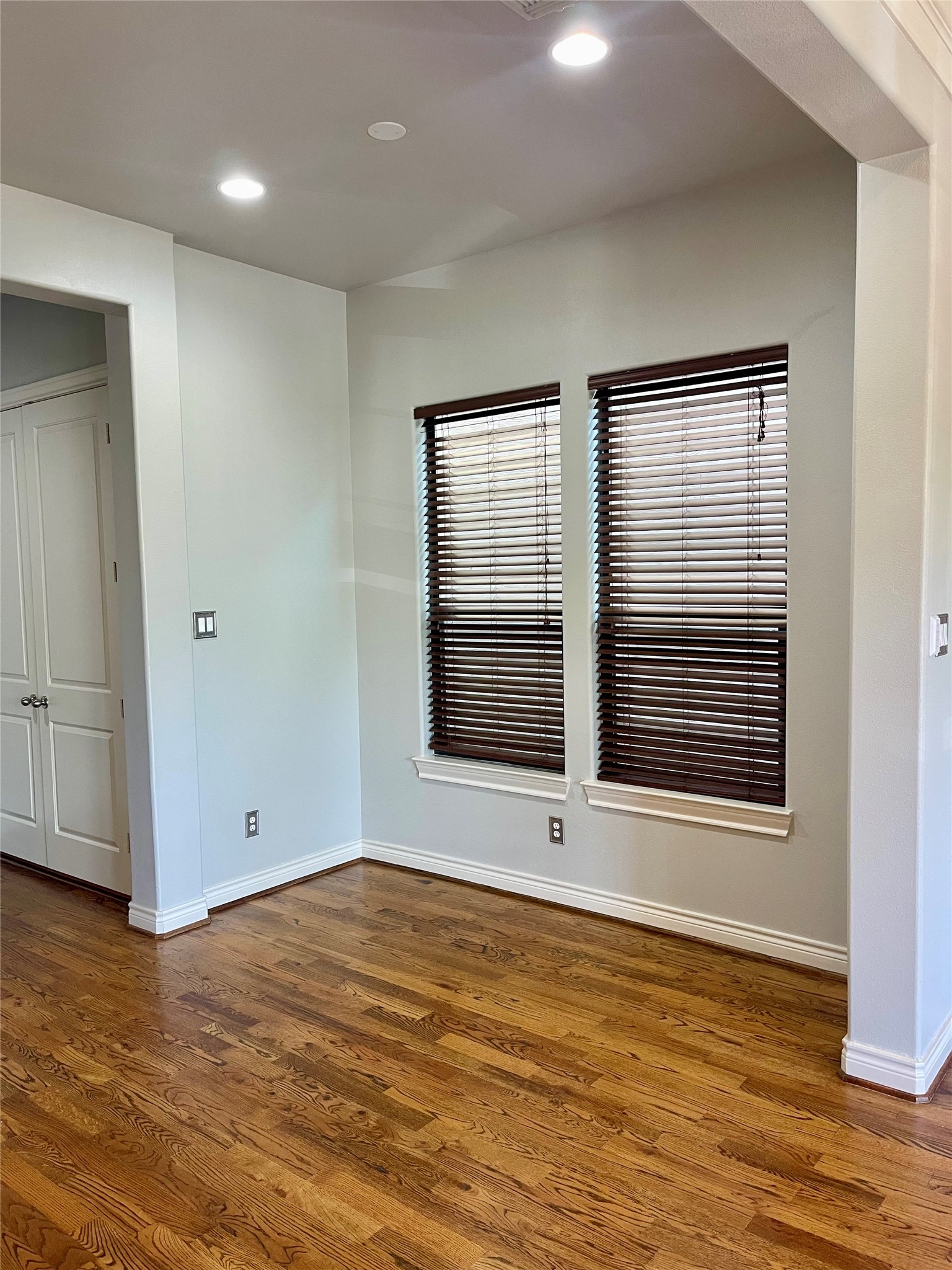 5719 Darling Street Houston, TX 77007 - Photo 21 of 35 a view of an empty room with wooden floor and a window