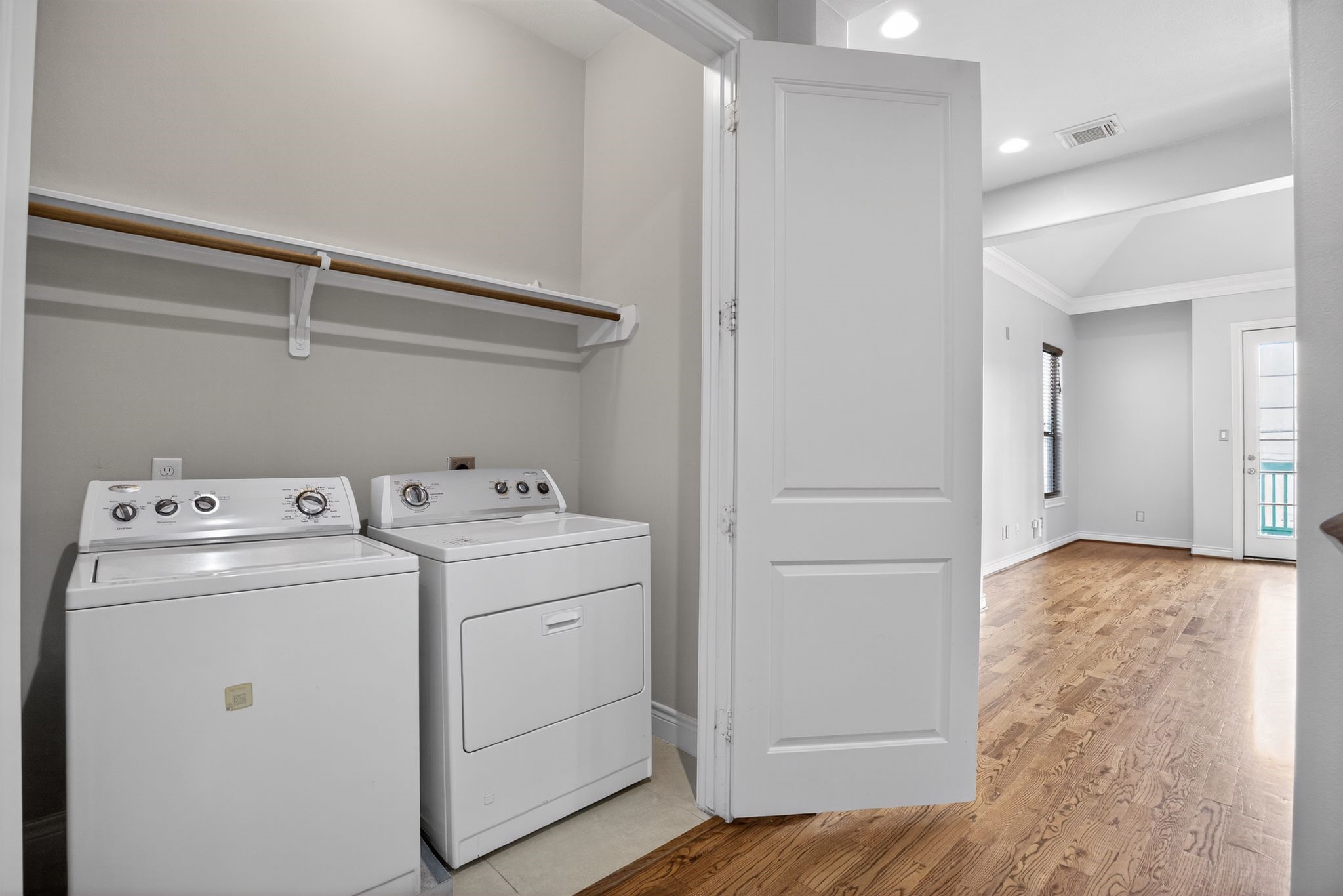 5719 Darling Street Houston, TX 77007 - Photo 22 of 35 a view of storage and utility room with a washer and dryer