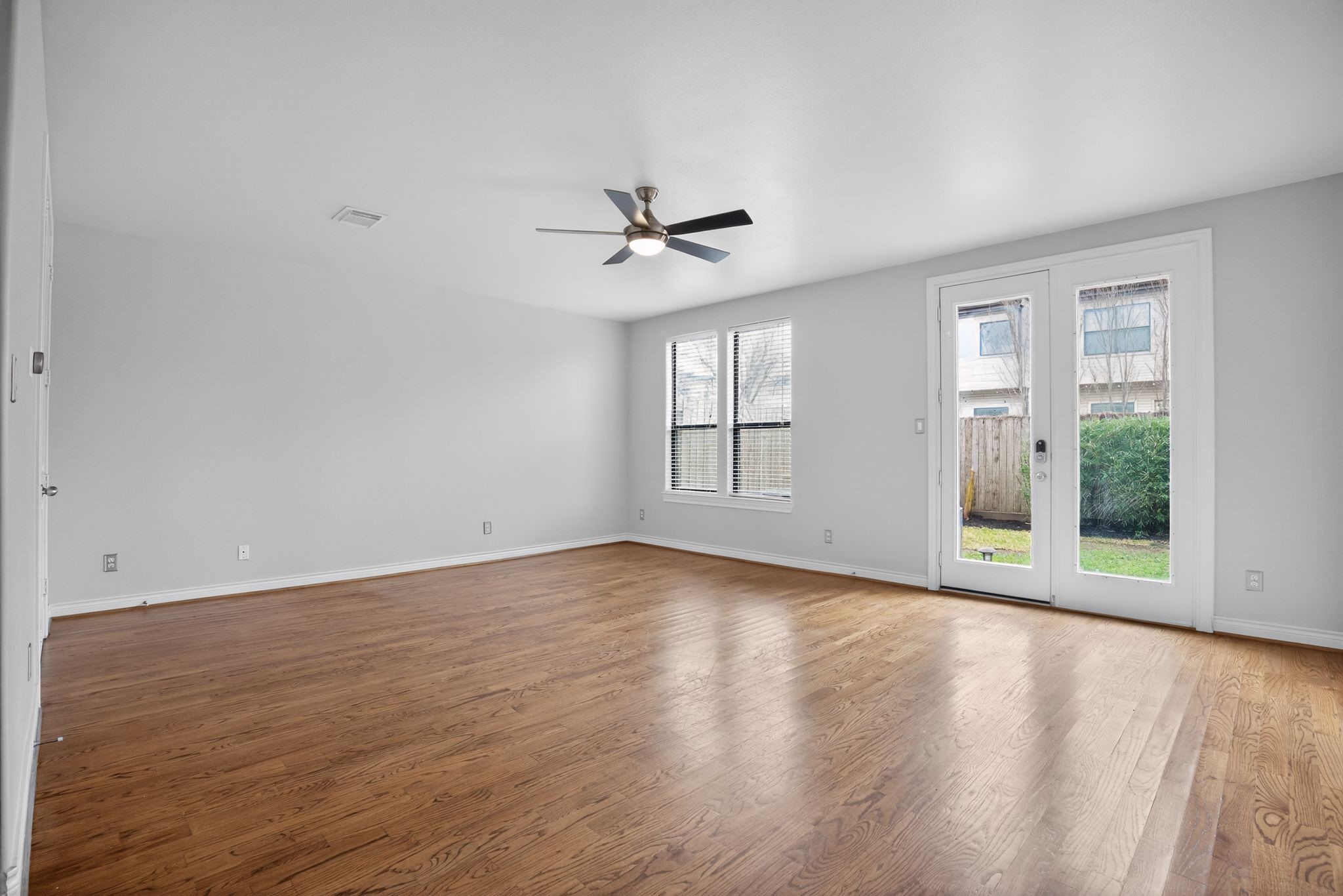 5719 Darling Street Houston, TX 77007 - Photo 4 of 35 wooden floor in an empty room with a window