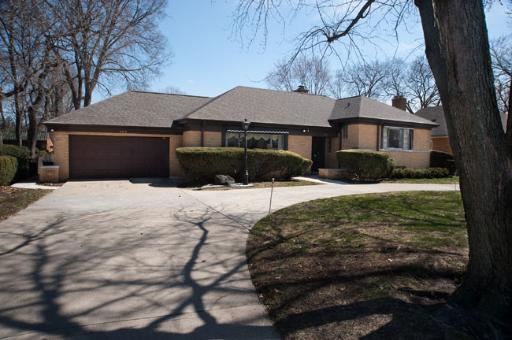 157 Longcommon Road Riverside, IL 60546 - Photo 1 of 1 a front view of house with yard covered in snow