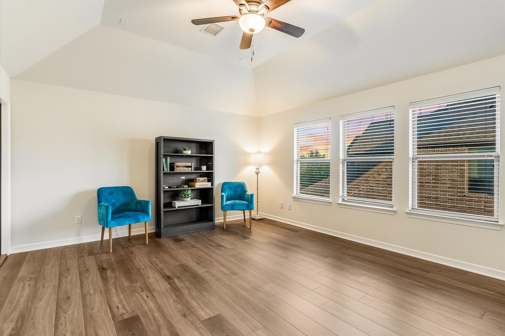 226 Galloway Lane Austin, TX 78737 - Photo 15 of 30 Unfurnished room featuring dark wood finished floors, a ceiling fan, and lofted ceiling