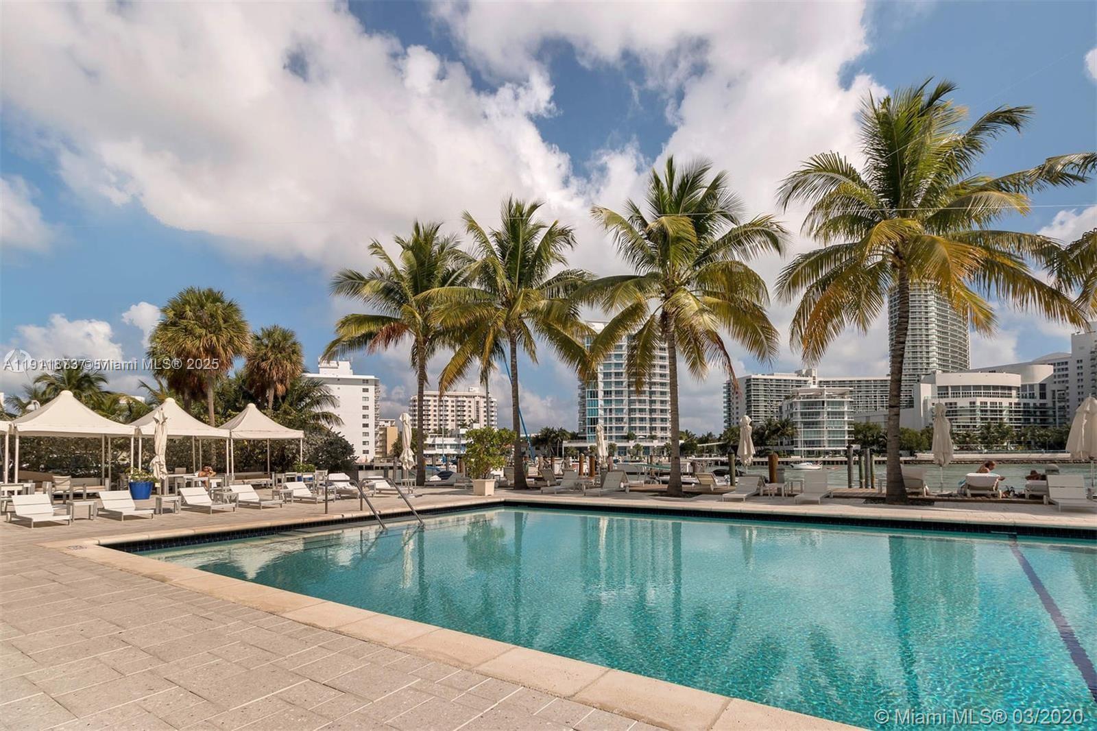 20 Island Avenue, Unit 209 Miami Beach, FL 33139 - Photo 11 of 12 a view of swimming pool with outdoor seating and lake