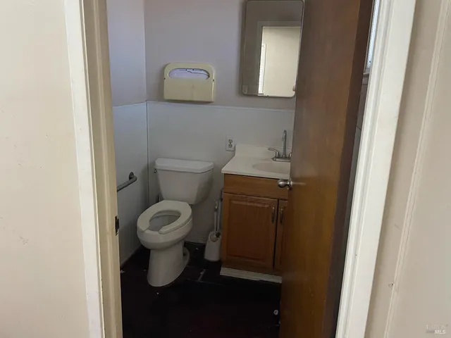 a bathroom with a double vanity sink and window