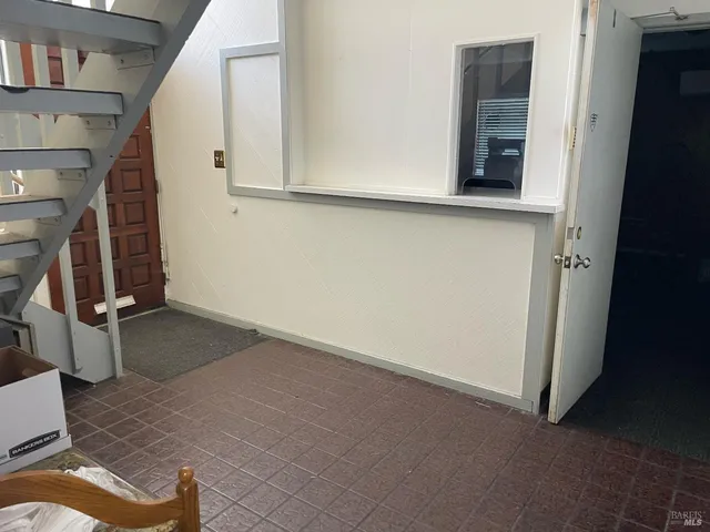 a room with gym equipment and a large window