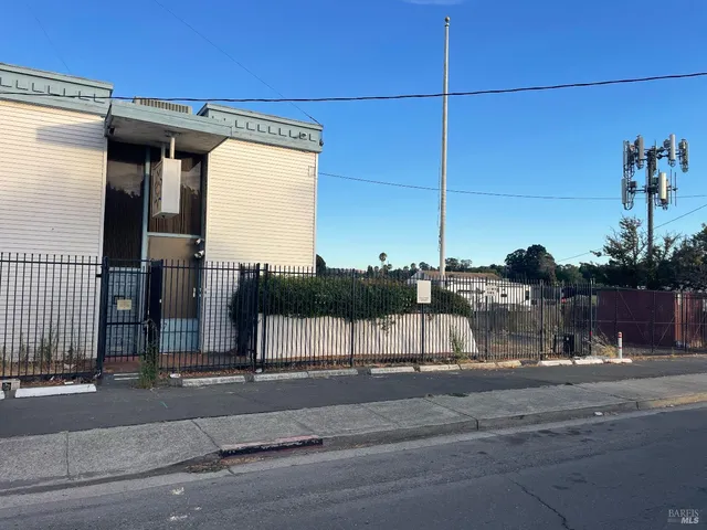 a view of a street with a building in the background