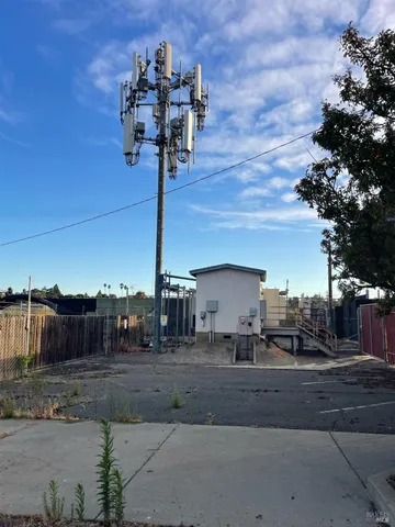a view of a street with a building in the background