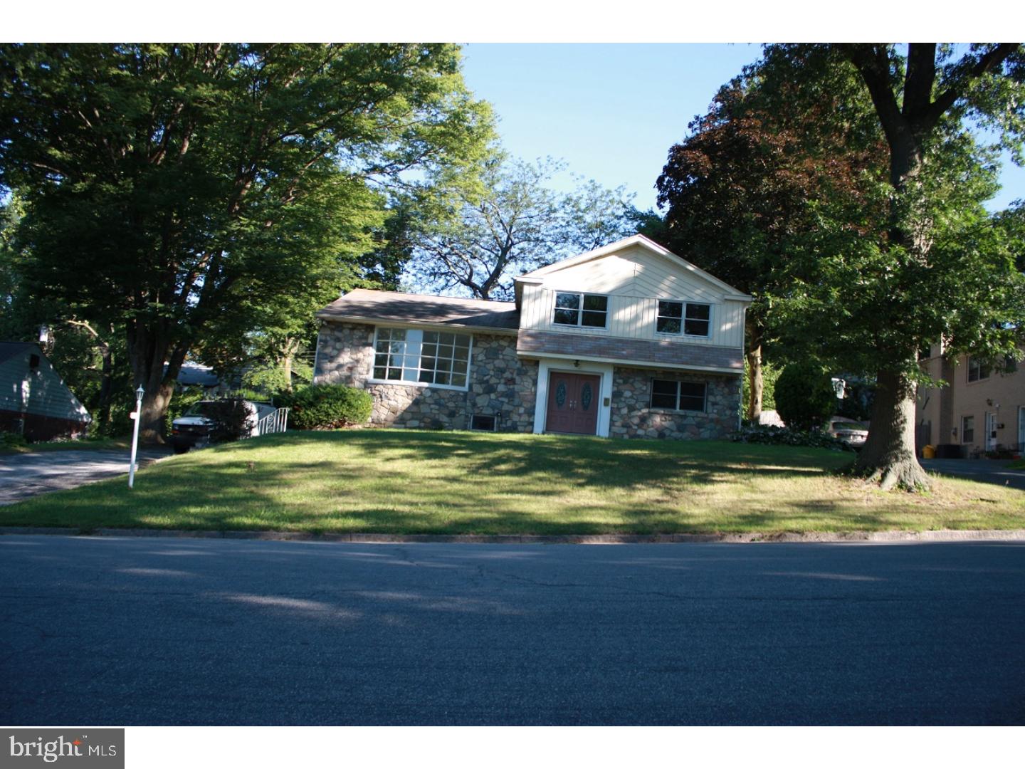 a front view of a house with swimming pool having outdoor seating