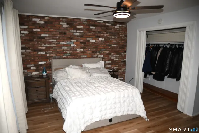 a view of an empty room with a ceiling fan