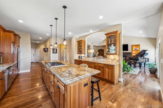 a open kitchen with a table and chairs in it
