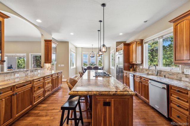 a large kitchen with kitchen island granite countertop a large island in the center