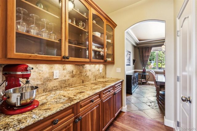 a view of a kitchen with a sink and cabinets