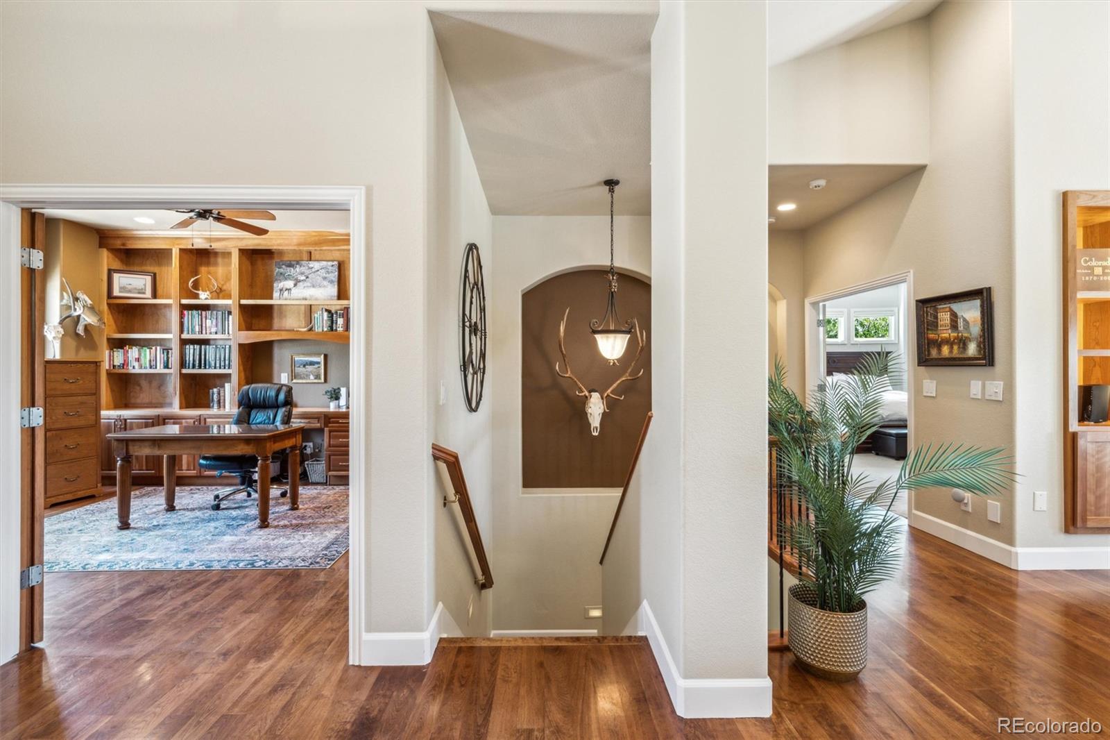 5159 Warbler Court Parker, CO 80134 - Photo 17 of 50 a view of a dining room with furniture and wooden floor
