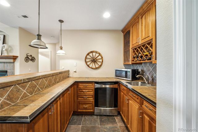 a kitchen with a cabinets and chandelier