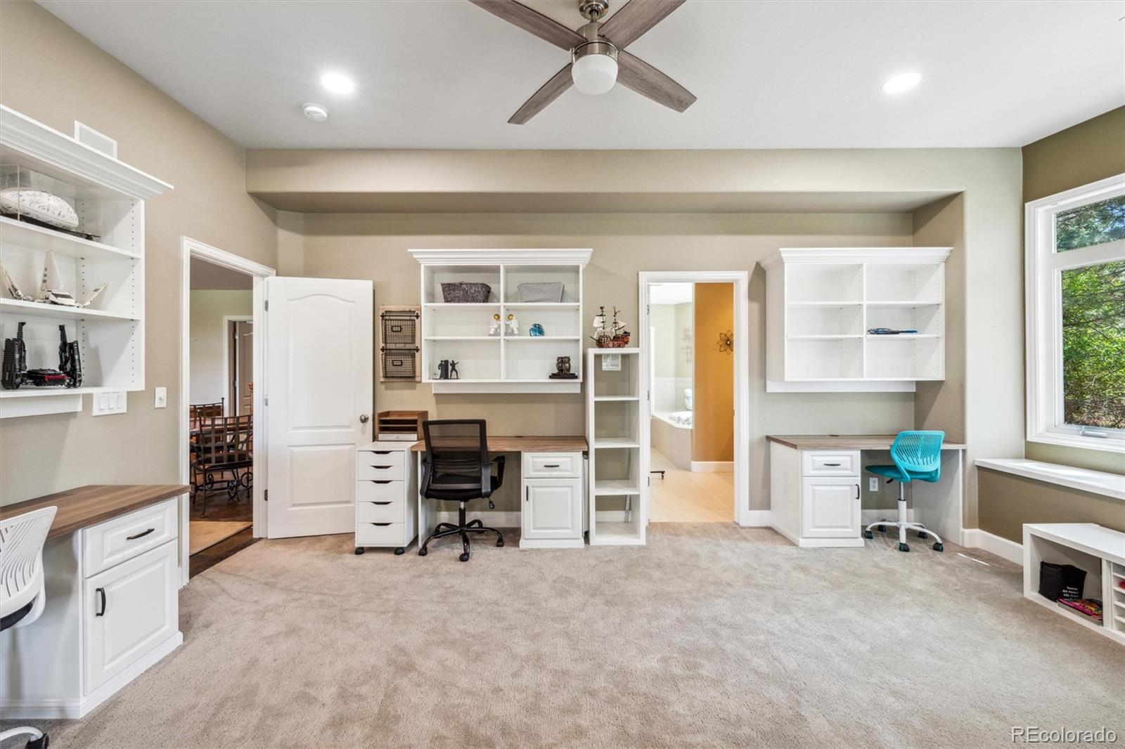 5159 Warbler Court Parker, CO 80134 - Photo 30 of 50 a view of a bedroom with furniture and windows