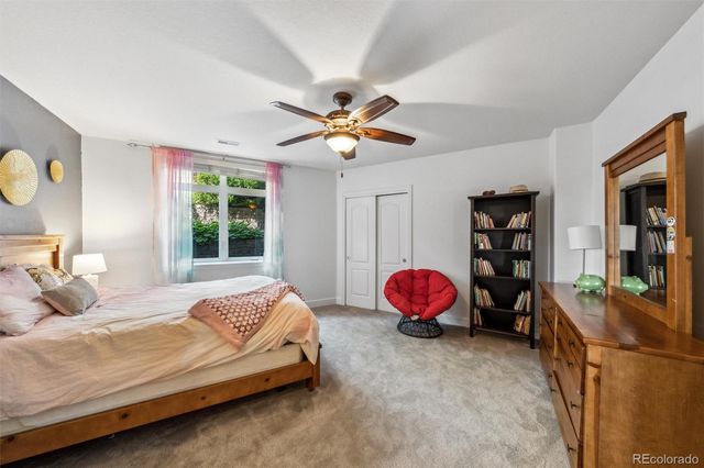 a spacious bathroom with a sink a shower and a mirror