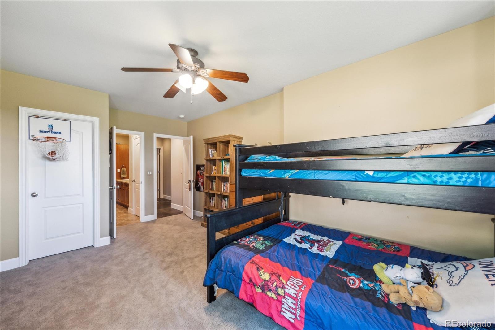5159 Warbler Court Parker, CO 80134 - Photo 36 of 50 a bedroom with furniture and a bed