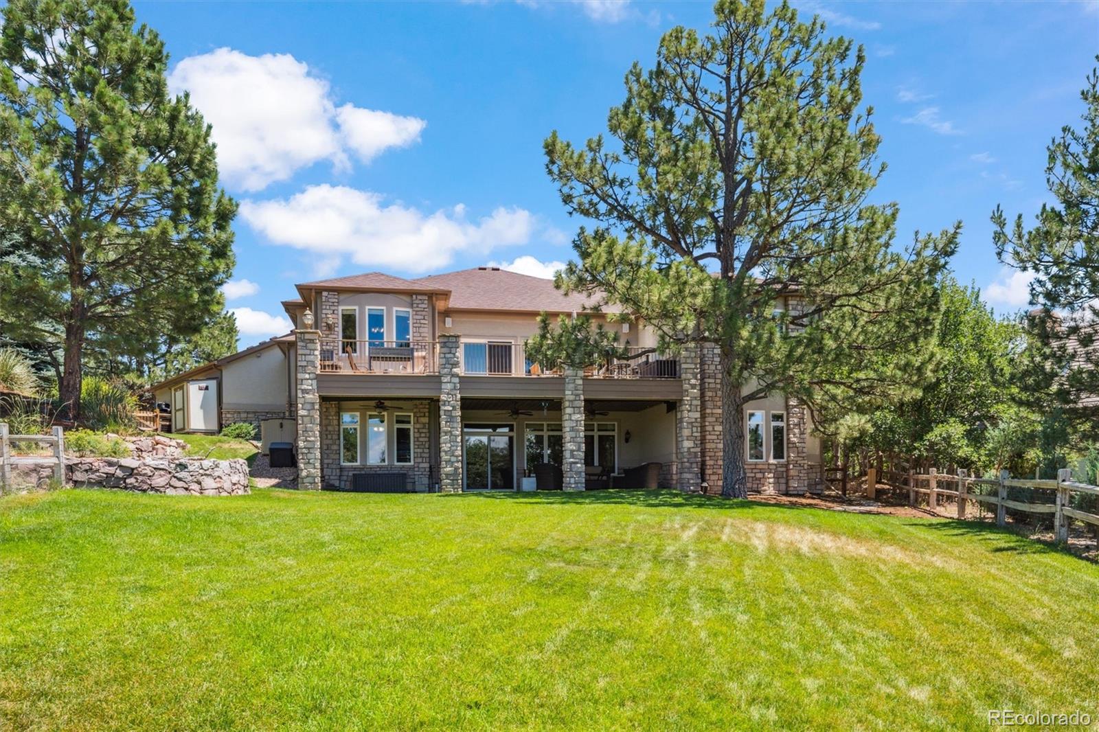 5159 Warbler Court Parker, CO 80134 - Photo 40 of 50 a view of a house with a swimming pool