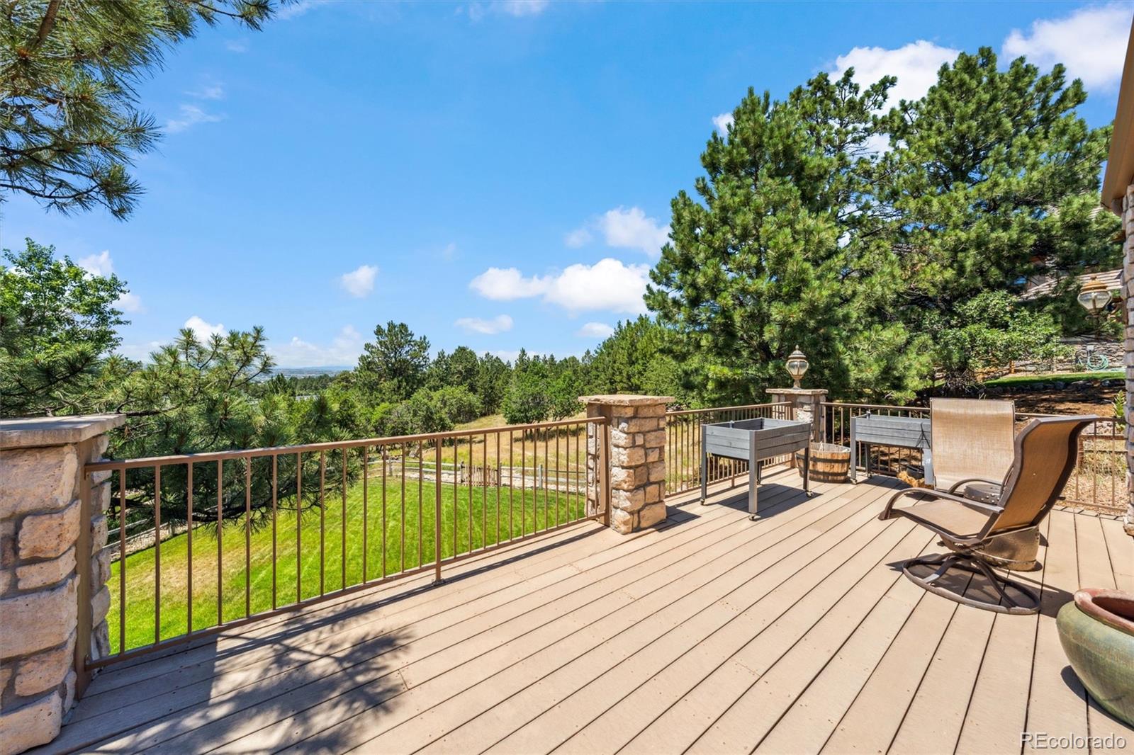 5159 Warbler Court Parker, CO 80134 - Photo 43 of 50 a view of a balcony with wooden floor and seating space