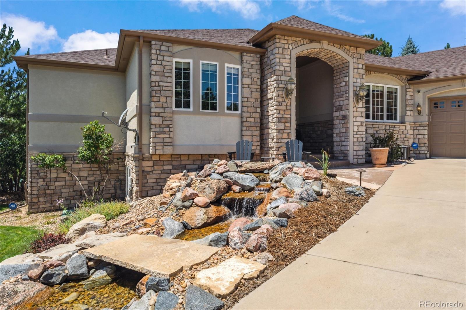 5159 Warbler Court Parker, CO 80134 - Photo 45 of 50 a front view of a house with a yard