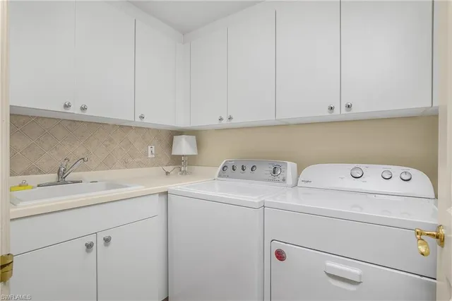 a utility room with dryer and washer