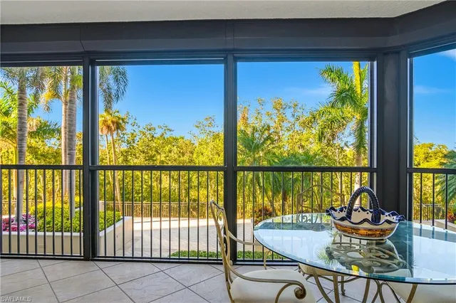 a balcony with furniture and water view