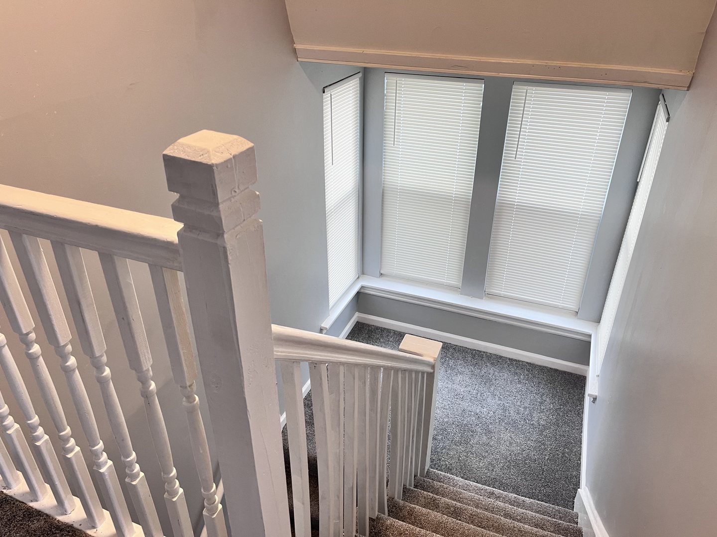 10739 South State Street Chicago, IL 60628 - Photo 9 of 14 a view of staircase with white walls and a window