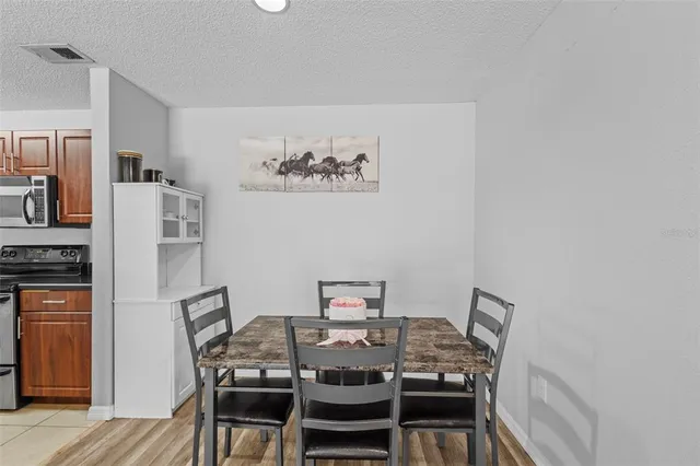 a view of a dining room with furniture