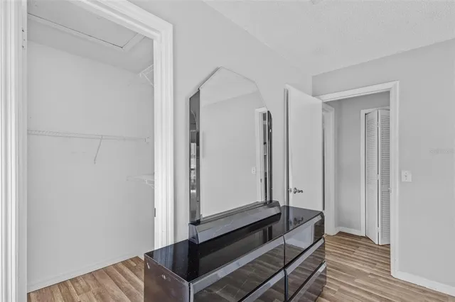 a view of room with wooden floor