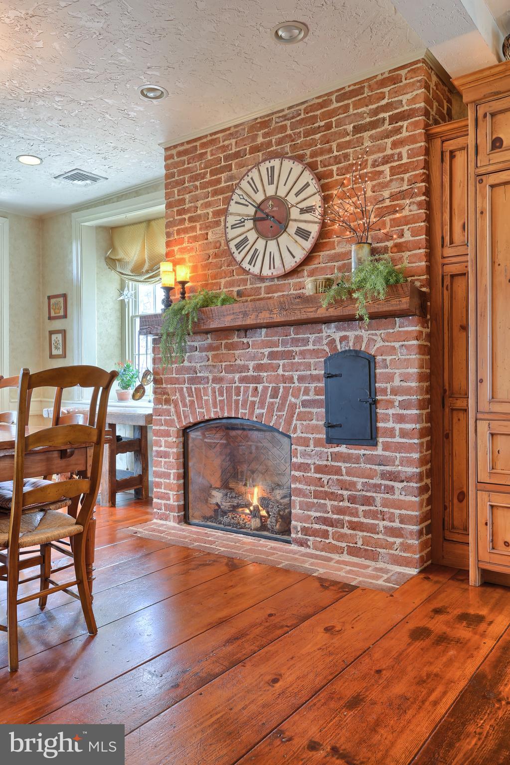 1500 Schaeffer Road Newmanstown, PA 17073 - Photo 16 of 97 Custom Gas Fireplace with Brick Surround