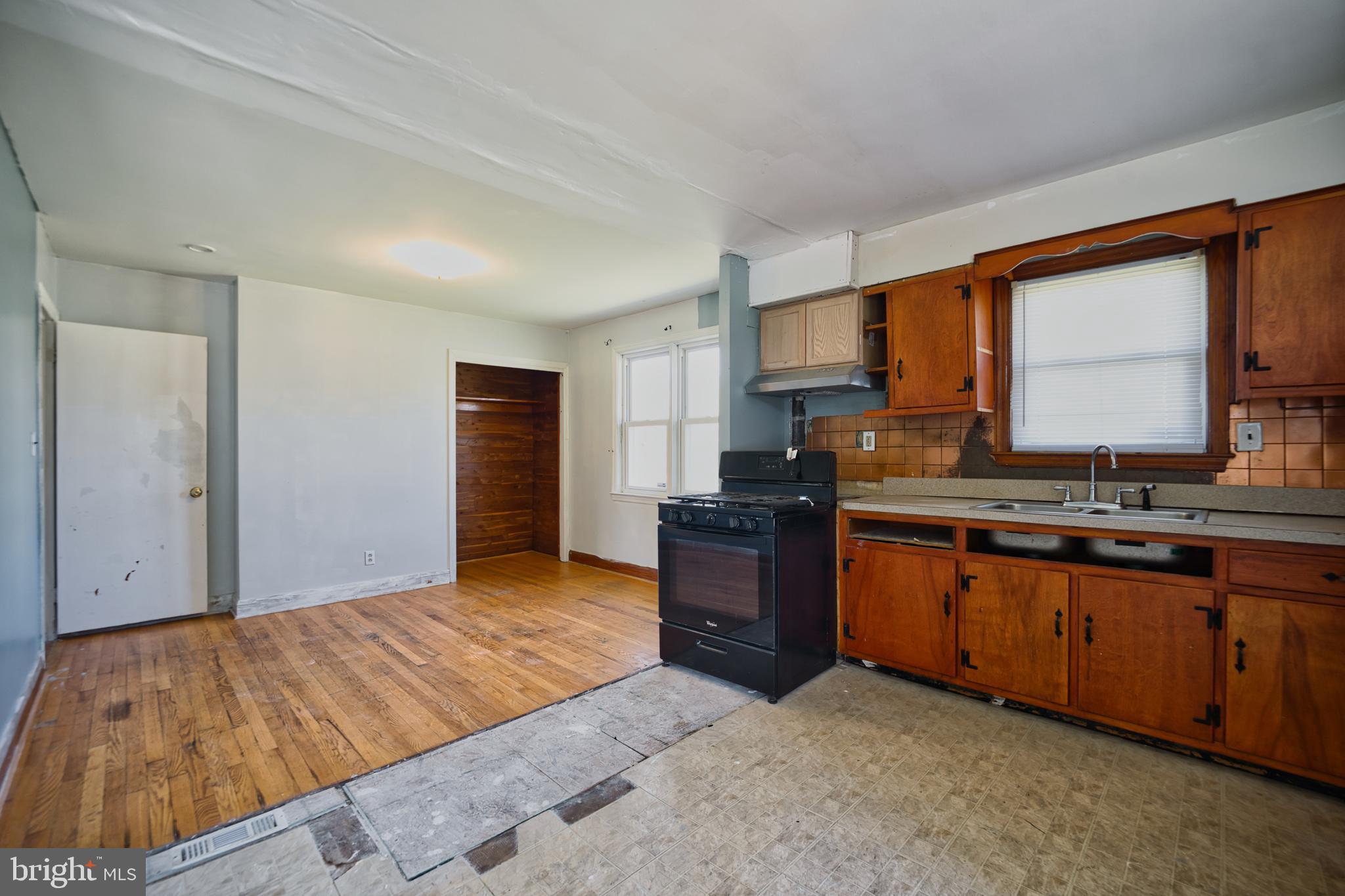 100 9th Avenue Baltimore, MD 21225 - Photo 11 of 38 a bedroom with a bed and dresser