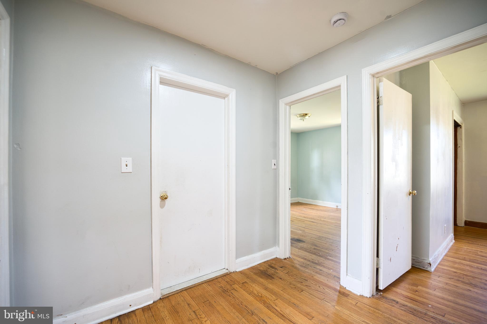 100 9th Avenue Baltimore, MD 21225 - Photo 20 of 38 a view of hallway with wooden floor