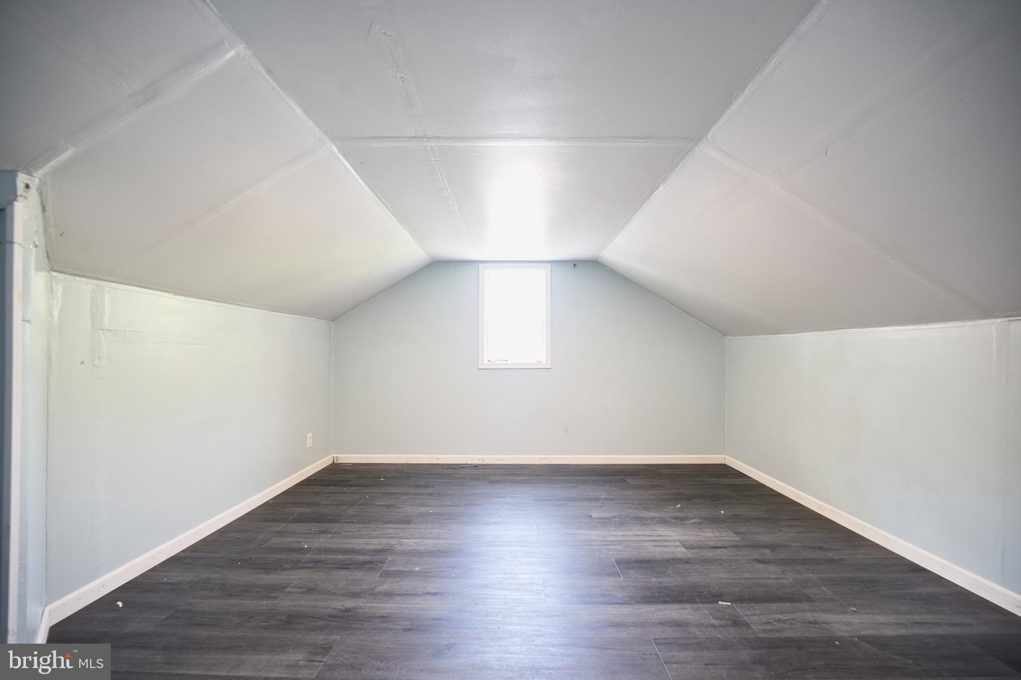 100 9th Avenue Baltimore, MD 21225 - Photo 28 of 38 wooden floor in an empty room with a window