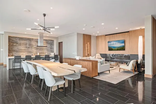 a large kitchen with a table and chairs