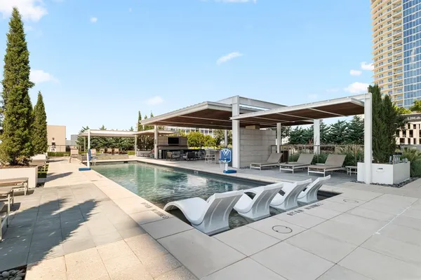 a view of a patio with swimming pool table and chairs